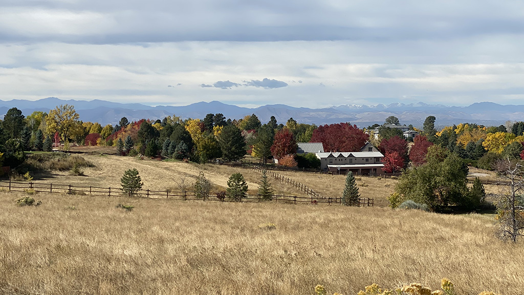 Cherry Hills Village home with fall foliage and mountain views